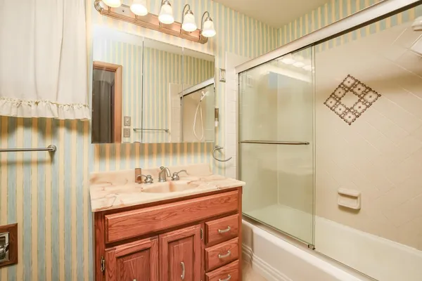 a bathroom with a sink and a mirror