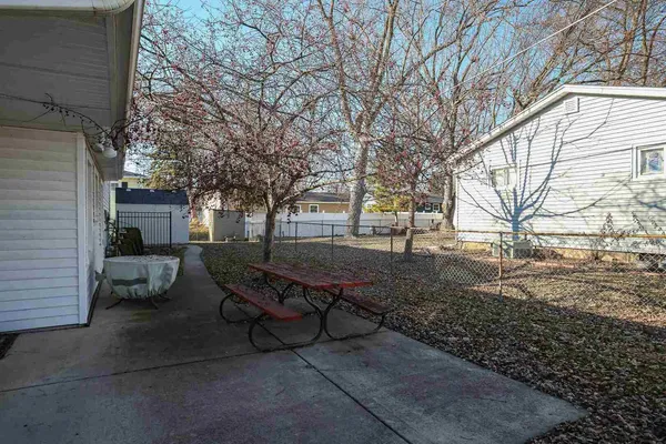 a view of a backyard with sitting area