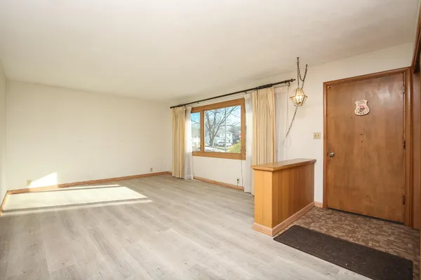 a view of an empty room and window