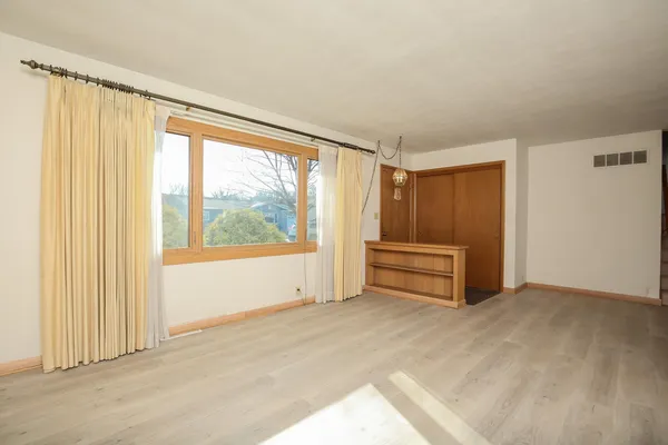 a view of an empty room with a window