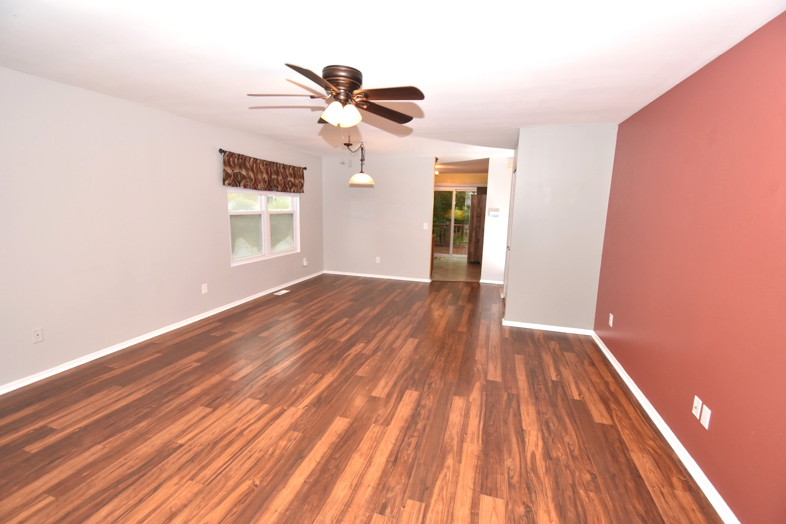 170 Hamlet Circle Montgomery, IL 60538 - Photo 6 of 13 a view of empty room with wooden floor