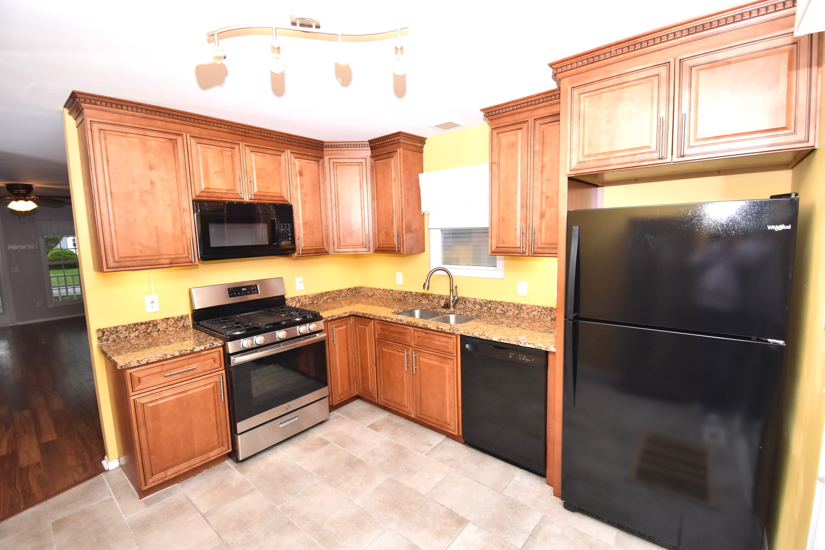 170 Hamlet Circle Montgomery, IL 60538 - Photo 8 of 13 a kitchen with stainless steel appliances granite countertop a refrigerator stove top oven and sink