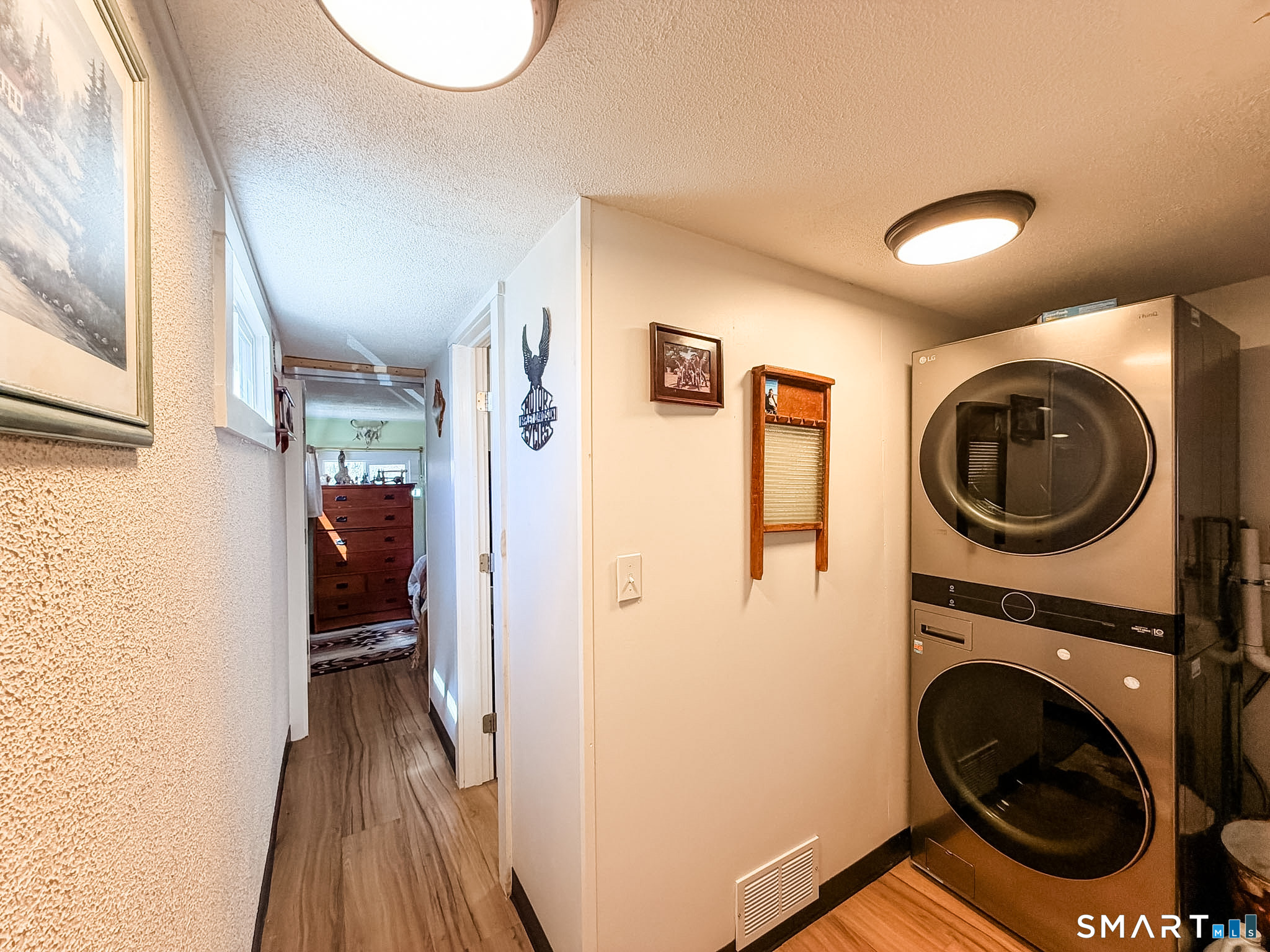 16 Conrad's Park Killingly, CT 06241 - Photo 11 of 12 a view of a hallway with washer and dryer