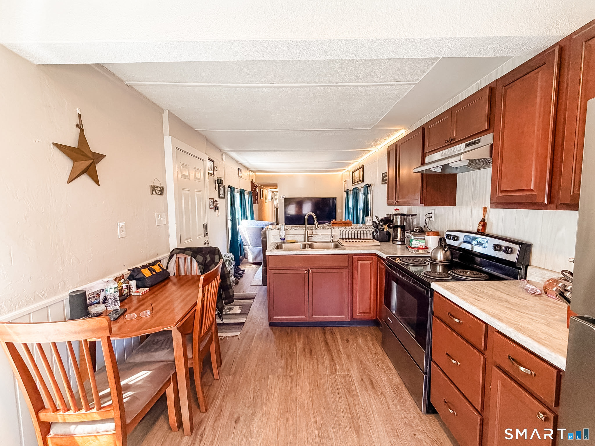 16 Conrad's Park Killingly, CT 06241 - Photo 2 of 12 a kitchen with stainless steel appliances a stove a sink dishwasher and a refrigerator