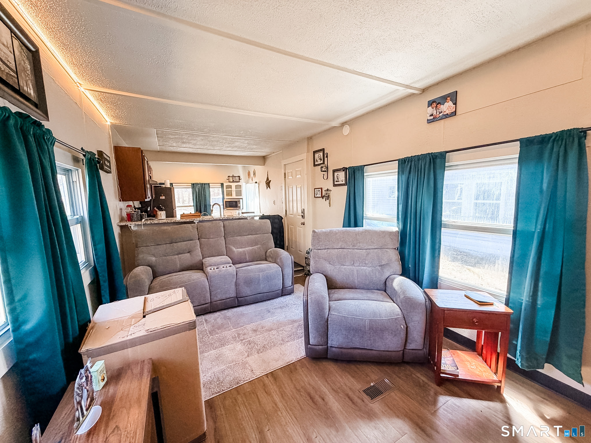 16 Conrad's Park Killingly, CT 06241 - Photo 3 of 12 a living room with furniture and a large window