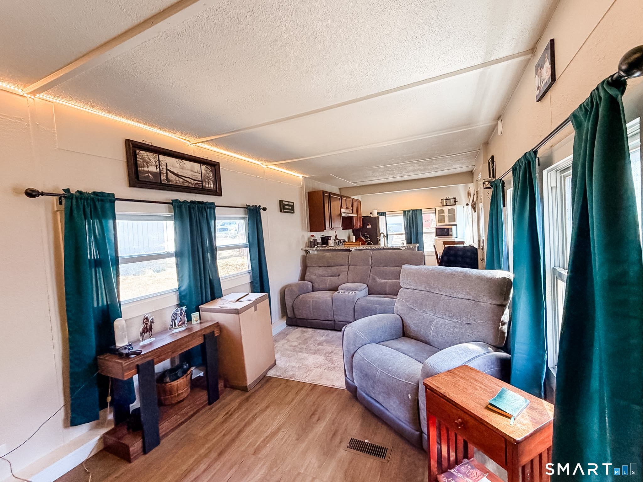 16 Conrad's Park Killingly, CT 06241 - Photo 4 of 12 a living room with furniture a wooden floor and a window