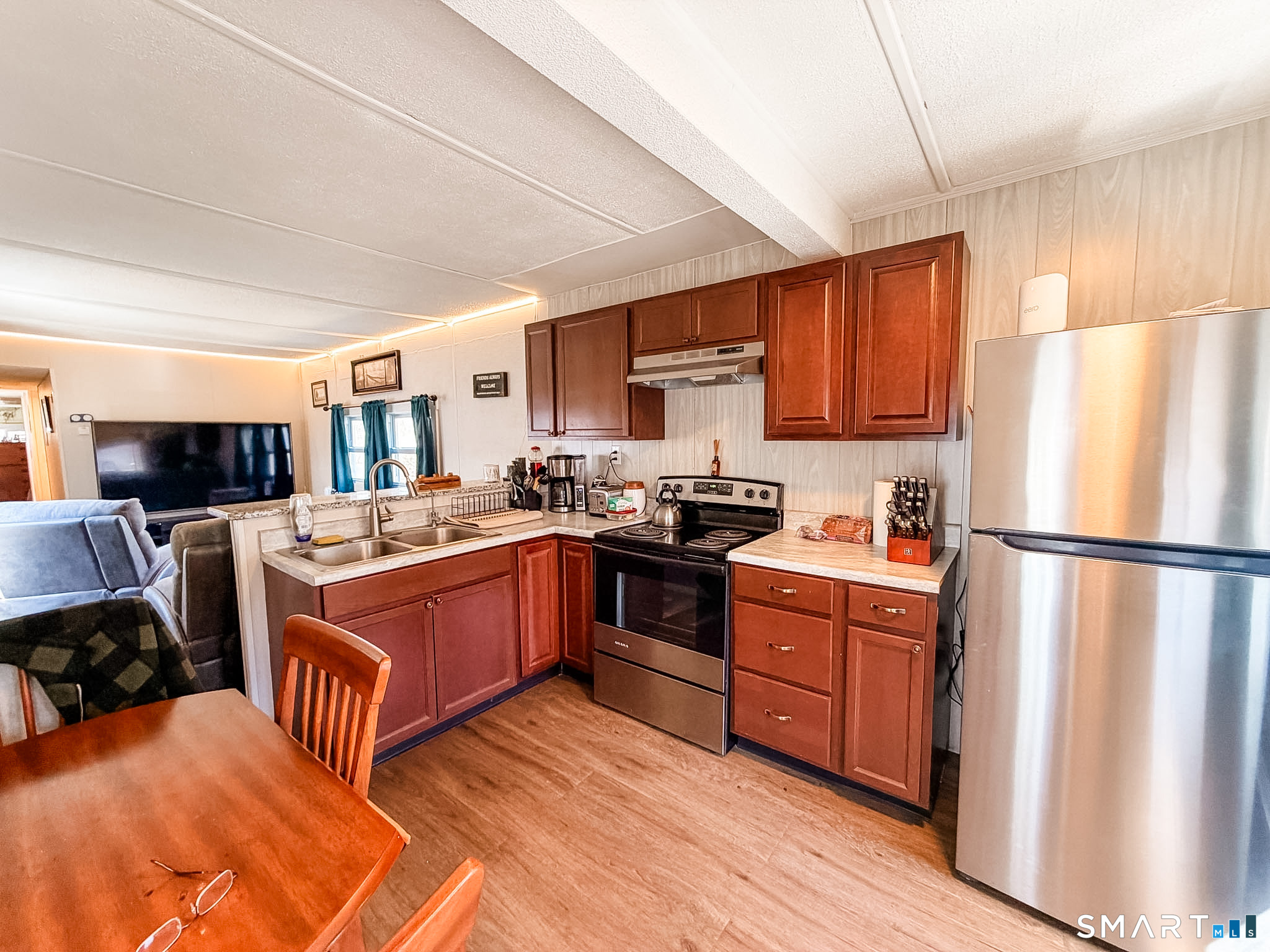 16 Conrad's Park Killingly, CT 06241 - Photo 6 of 12 a kitchen with stainless steel appliances granite countertop a refrigerator stove top oven and sink