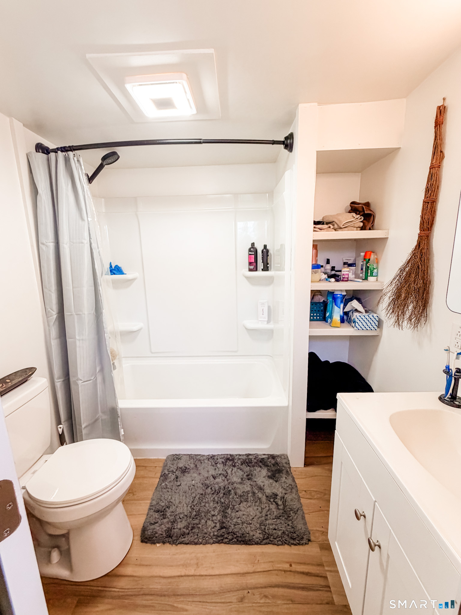 16 Conrad's Park Killingly, CT 06241 - Photo 9 of 12 a bathroom with a sink a toilet and a shower curtain