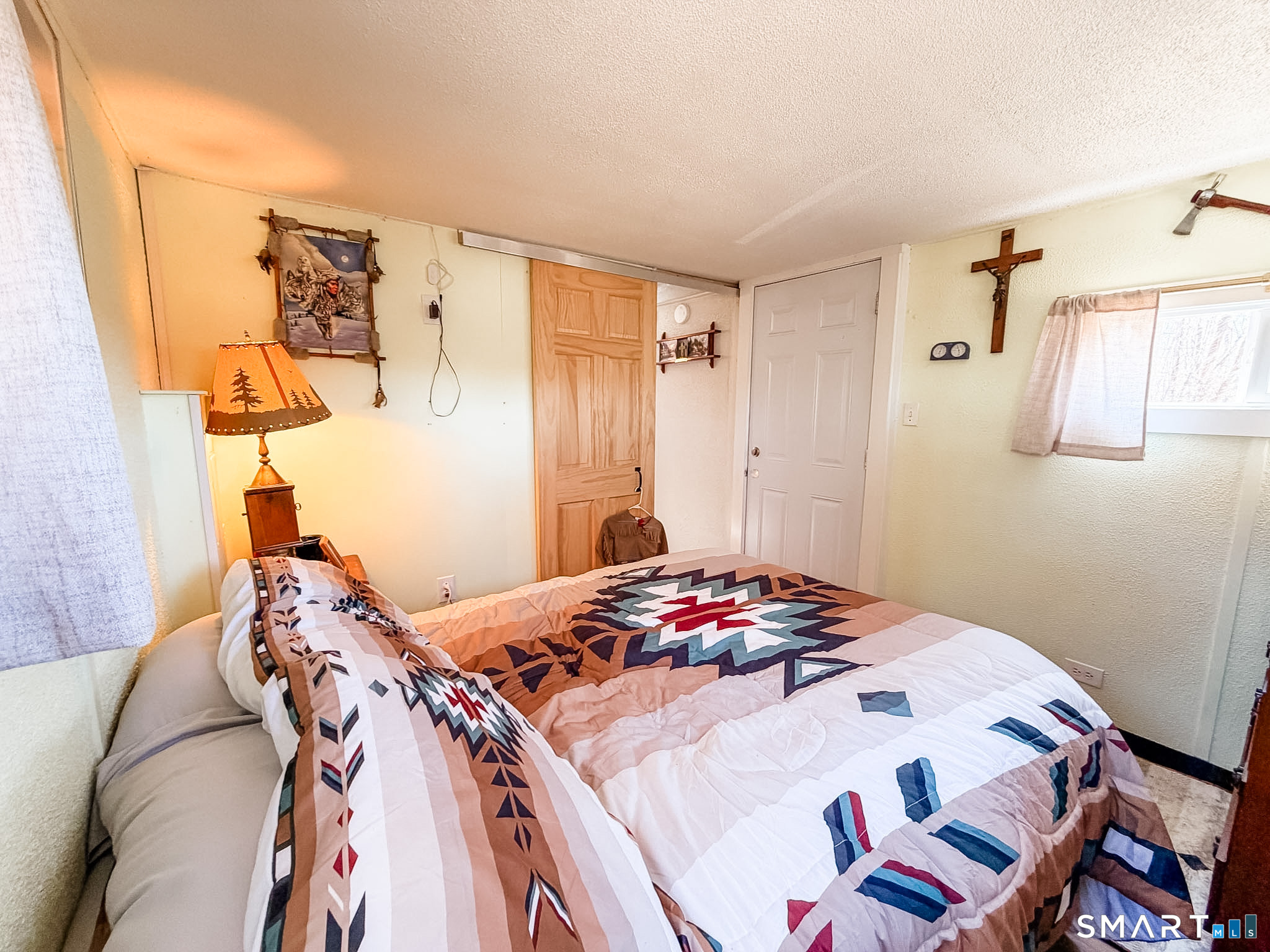 16 Conrad's Park Killingly, CT 06241 - Photo 10 of 12 a bedroom with a bed and a table