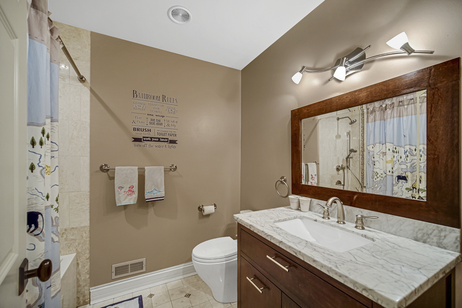 2800 Orange Brace Road Riverwoods, IL 60015 - Photo 19 of 41 a bathroom with a granite countertop sink a toilet and shower