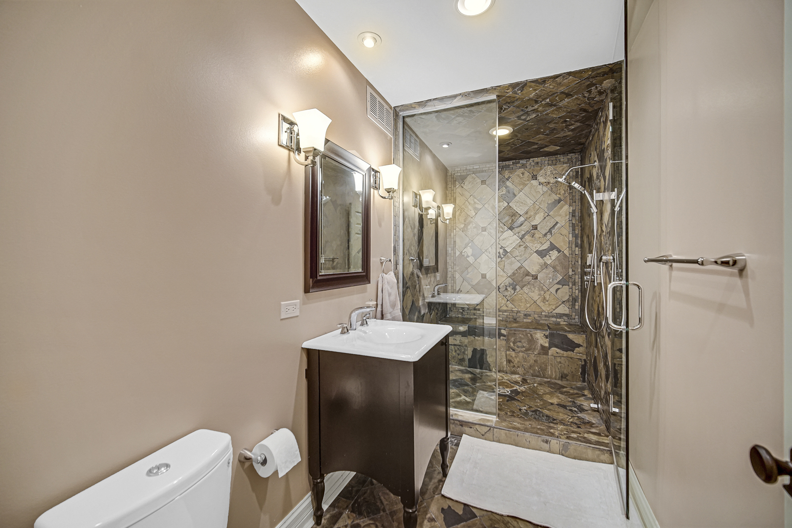 2800 Orange Brace Road Riverwoods, IL 60015 - Photo 22 of 41 a bathroom with a sink mirror toilet and shower