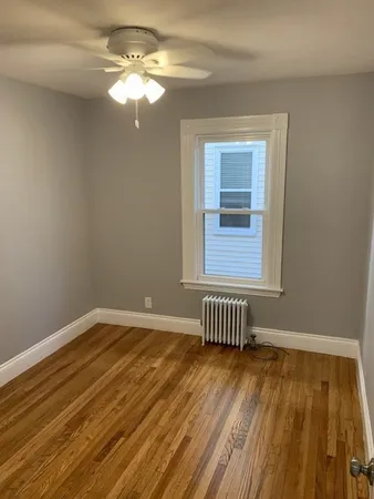 a view of livingroom with hardwood floor and a ceiling fan