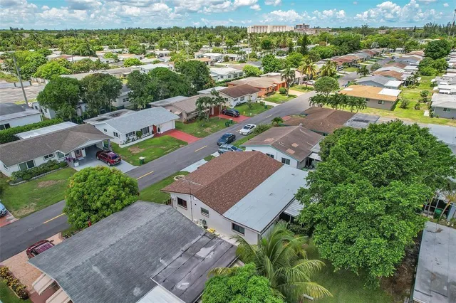 an aerial view of a house with a garden