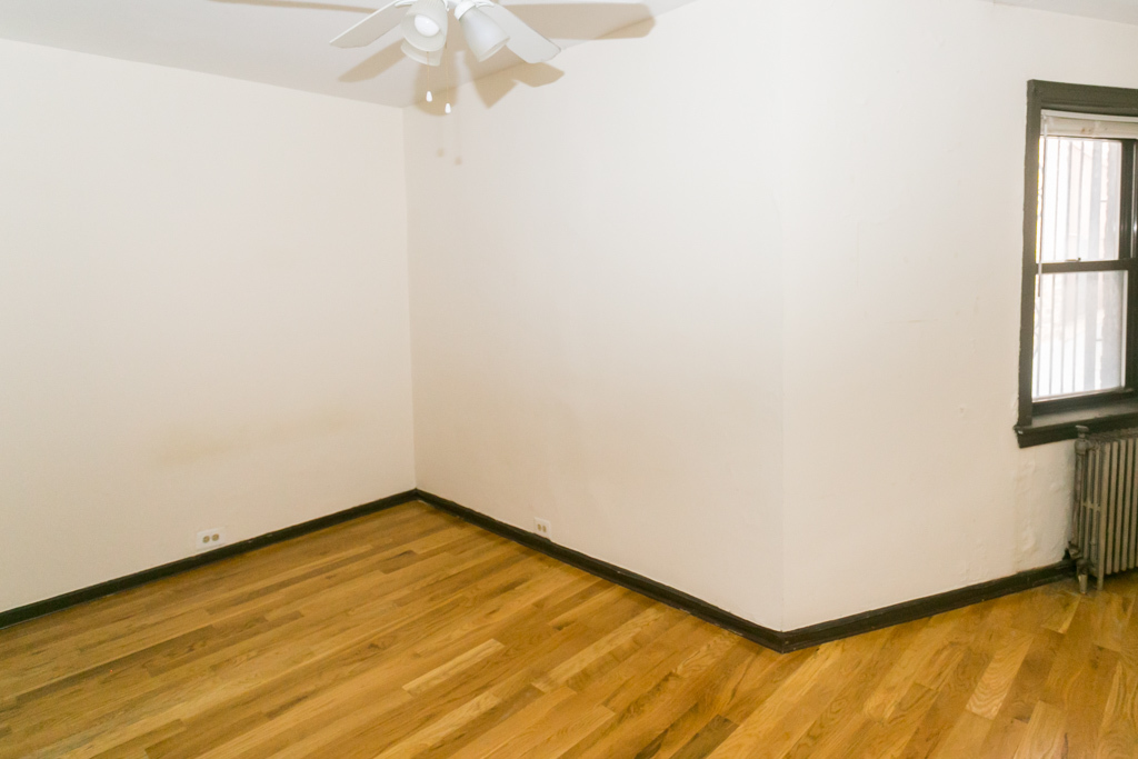 1211 West Elmdale Avenue, Unit 3 Chicago, IL 60660 - Photo 12 of 16 an empty room with windows