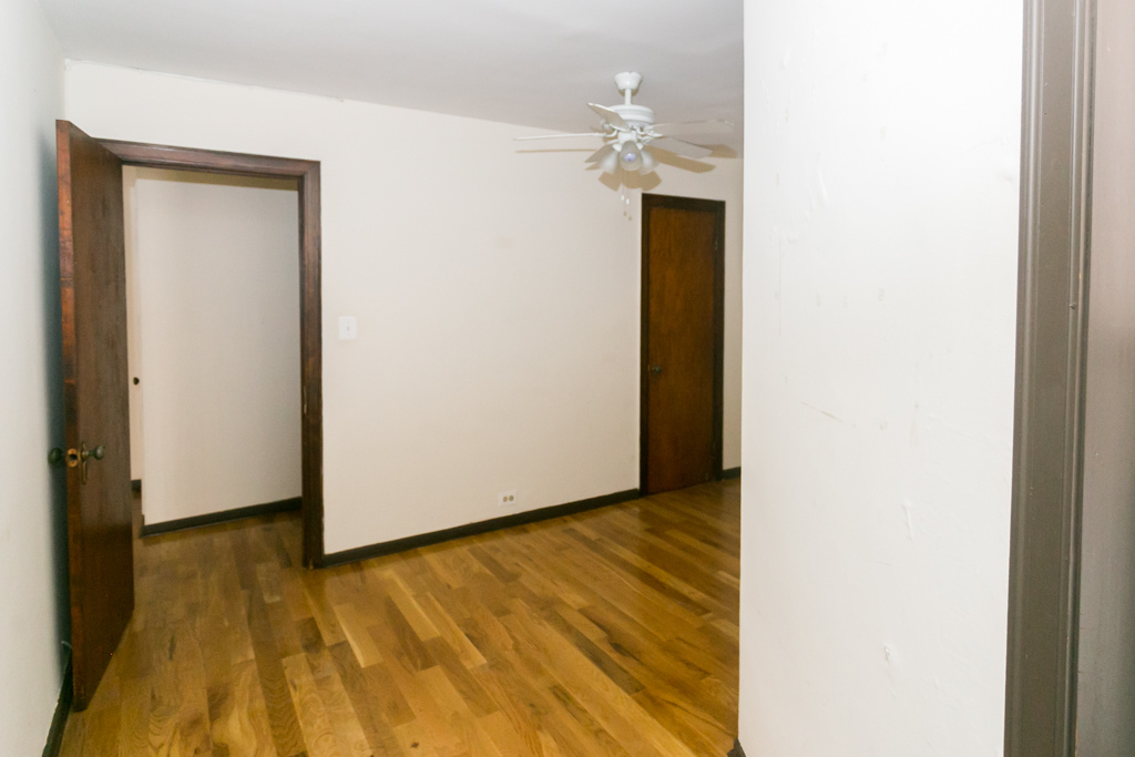 1211 West Elmdale Avenue, Unit 3 Chicago, IL 60660 - Photo 15 of 16 a view of an empty room with wooden floor