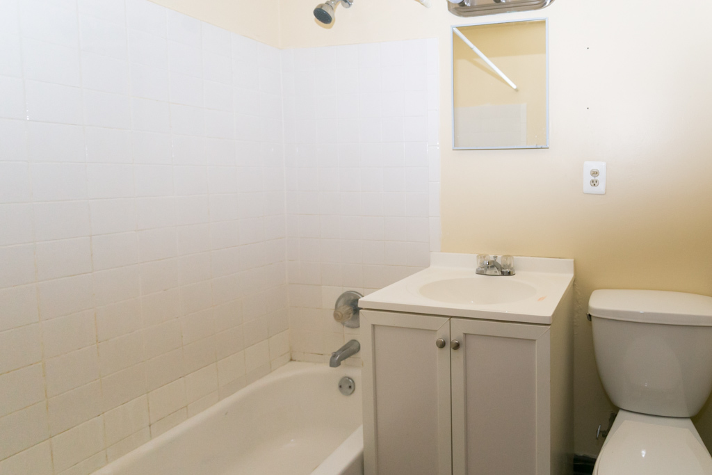 1211 West Elmdale Avenue, Unit 3 Chicago, IL 60660 - Photo 16 of 16 a bathroom with a sink toilet and vanity