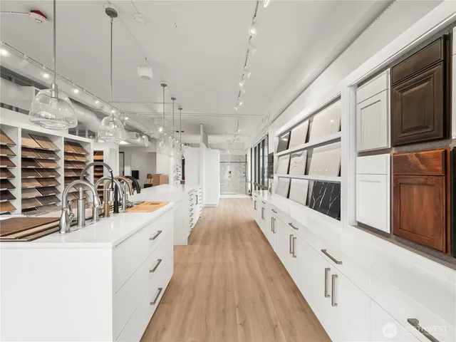 a kitchen with a sink stove and microwave