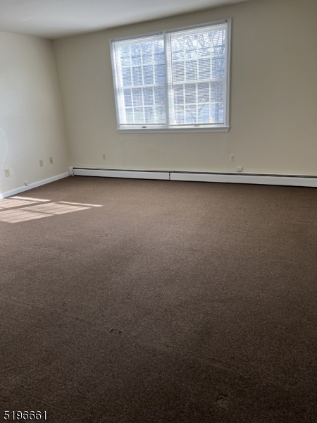 1483 Union Valley Road West Milford, NJ 07480 - Photo 5 of 7 an empty room with a window