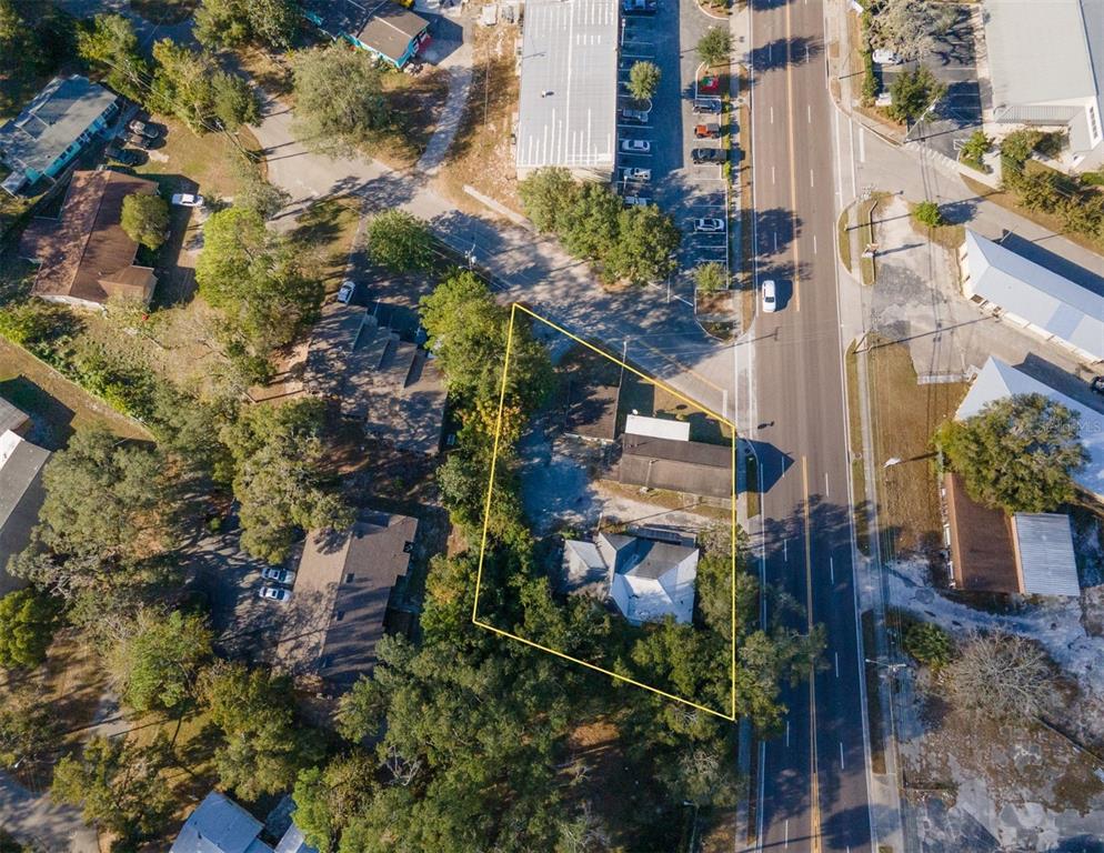 a view of a house with a tree