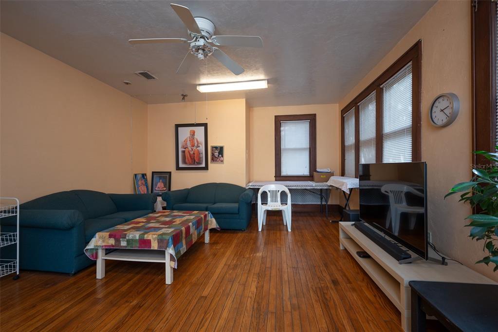 4016 Northwest 6th Street Gainesville, FL 32609 - Photo 15 of 20 a living room with furniture and a fireplace