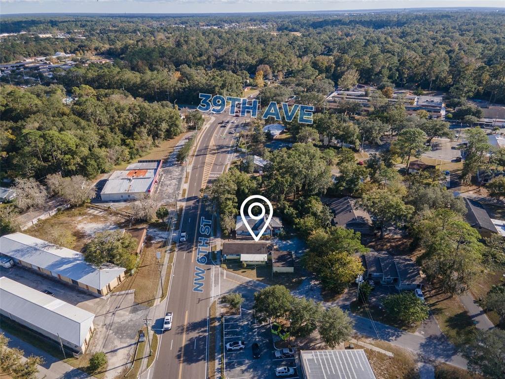 4016 Northwest 6th Street Gainesville, FL 32609 - Photo 2 of 20 an aerial view of a house with a yard and lake view