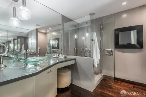 a bathroom with a sink double vanity and a mirror