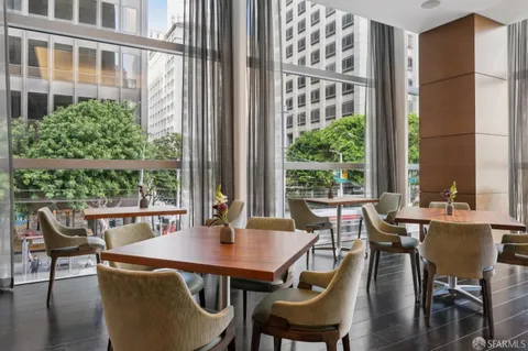 a view of a dining room with furniture window and outside view