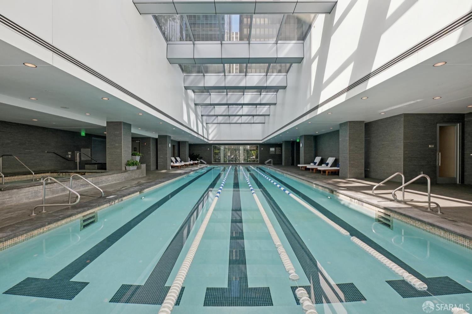301 Mission Street, Unit 35C San Francisco, CA 94105 - Photo 26 of 28 a view of swimming pool with a balcony furniture and a chandelier
