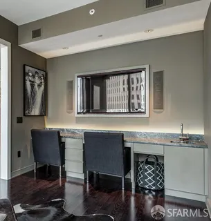 a living room with furniture a window and wall painting