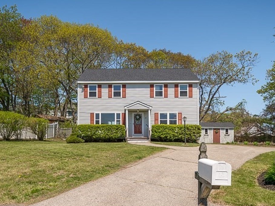 front view of a house with a yard