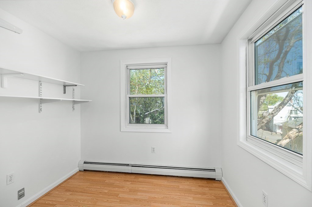 12 Crestview Terrace Gloucester, MA 01930 - Photo 19 of 27 wooden floor in an empty room with a window