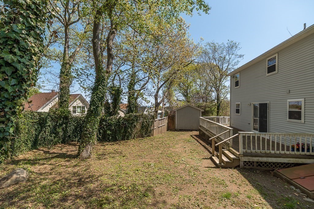 12 Crestview Terrace Gloucester, MA 01930 - Photo 26 of 27 a view of a roof deck with wooden fence and a couple of chairs