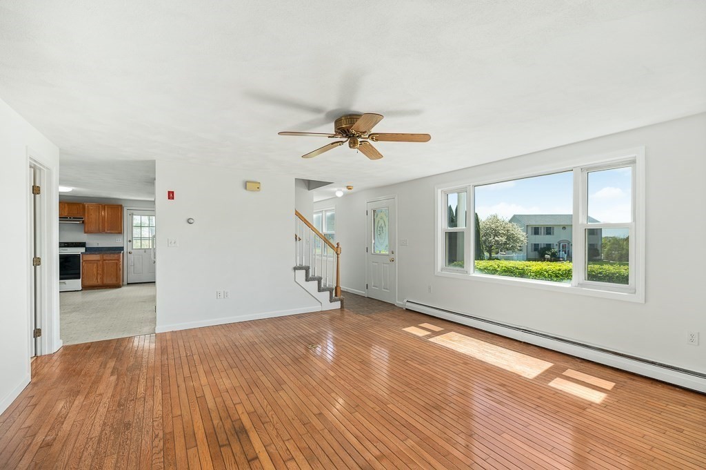 12 Crestview Terrace Gloucester, MA 01930 - Photo 5 of 27 a view of an empty room with a window and wooden floor