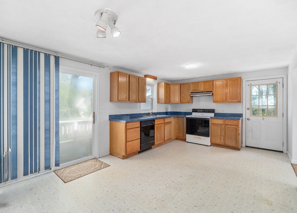 12 Crestview Terrace Gloucester, MA 01930 - Photo 8 of 27 a large kitchen with stainless steel appliances granite countertop a large counter top and a view of kitchen