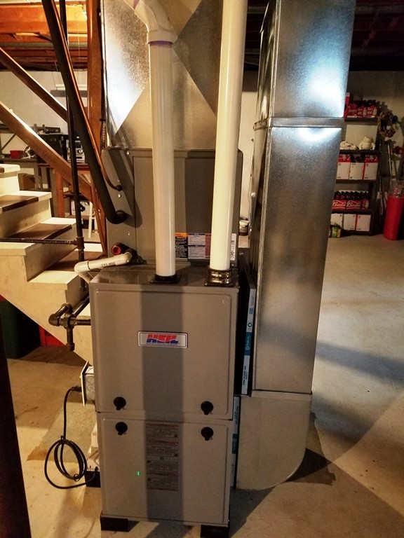 34 Higgins Street Springfield, MA 01108 - Photo 13 of 15 a close view of water heater room