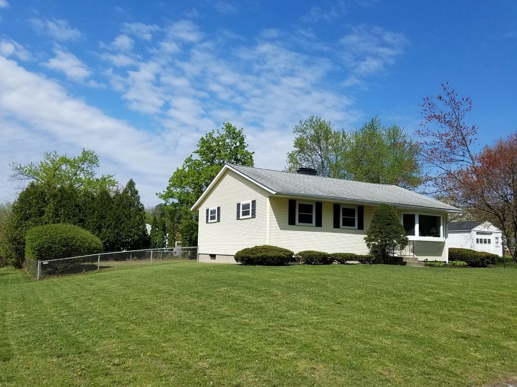 34 Higgins Street Springfield, MA 01108 - Photo 2 of 15 a front view of a house with a garden