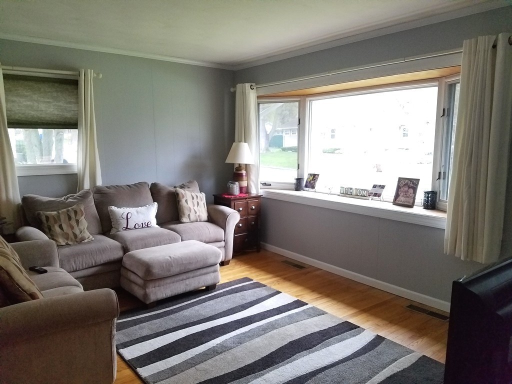 34 Higgins Street Springfield, MA 01108 - Photo 3 of 15 a living room with furniture and a window