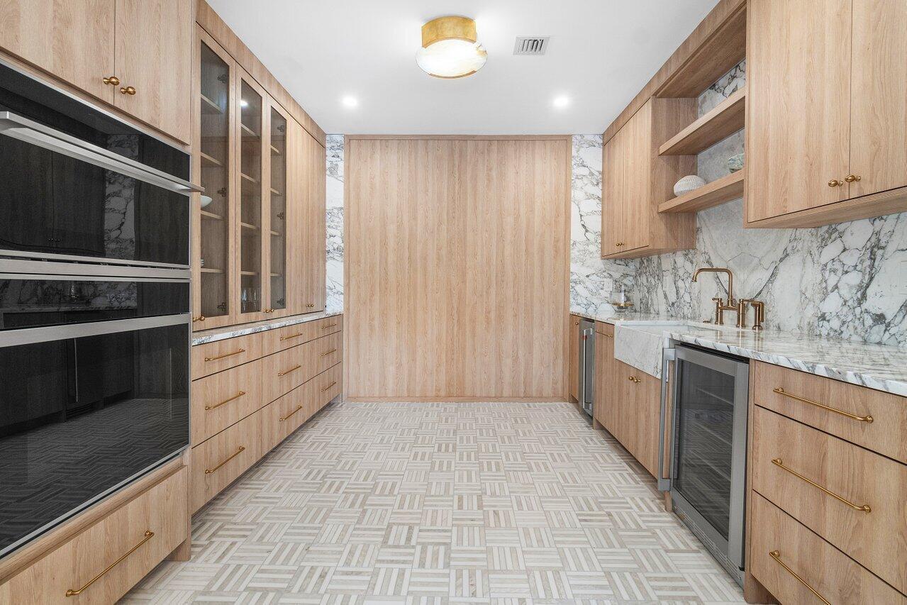 1366 Southwest 4th Court Boca Raton, FL 33432 - Photo 14 of 43 a kitchen with stainless steel appliances granite countertop a stove and a sink