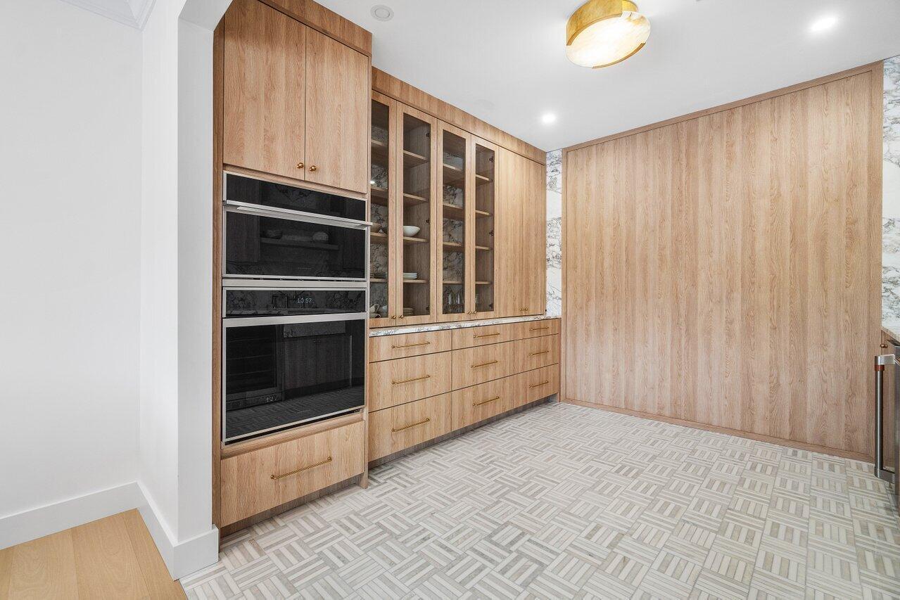 1366 Southwest 4th Court Boca Raton, FL 33432 - Photo 15 of 43 a view of an empty room with a kitchen