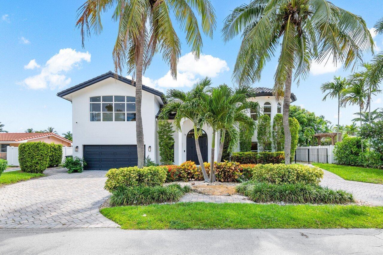 1366 Southwest 4th Court Boca Raton, FL 33432 - Photo 2 of 43 a front view of house with yard and green space