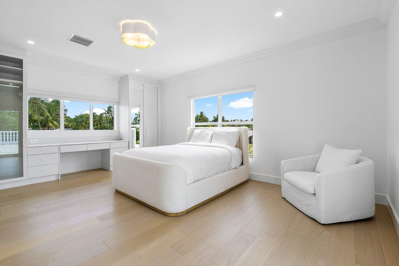 1366 Southwest 4th Court Boca Raton, FL 33432 - Photo 28 of 43 a bedroom with a bed and a couch