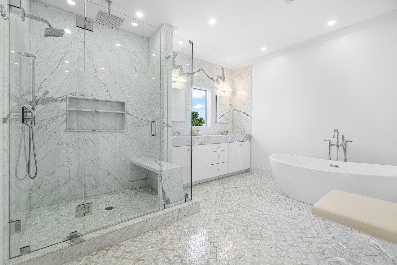 1366 Southwest 4th Court Boca Raton, FL 33432 - Photo 35 of 43 a bathroom with a bathtub shower sink and mirror