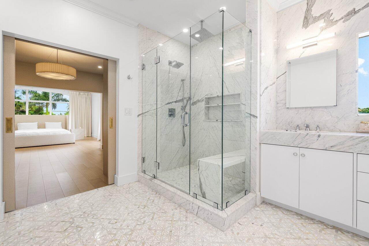 1366 Southwest 4th Court Boca Raton, FL 33432 - Photo 37 of 43 a bathroom with a shower sink and mirror