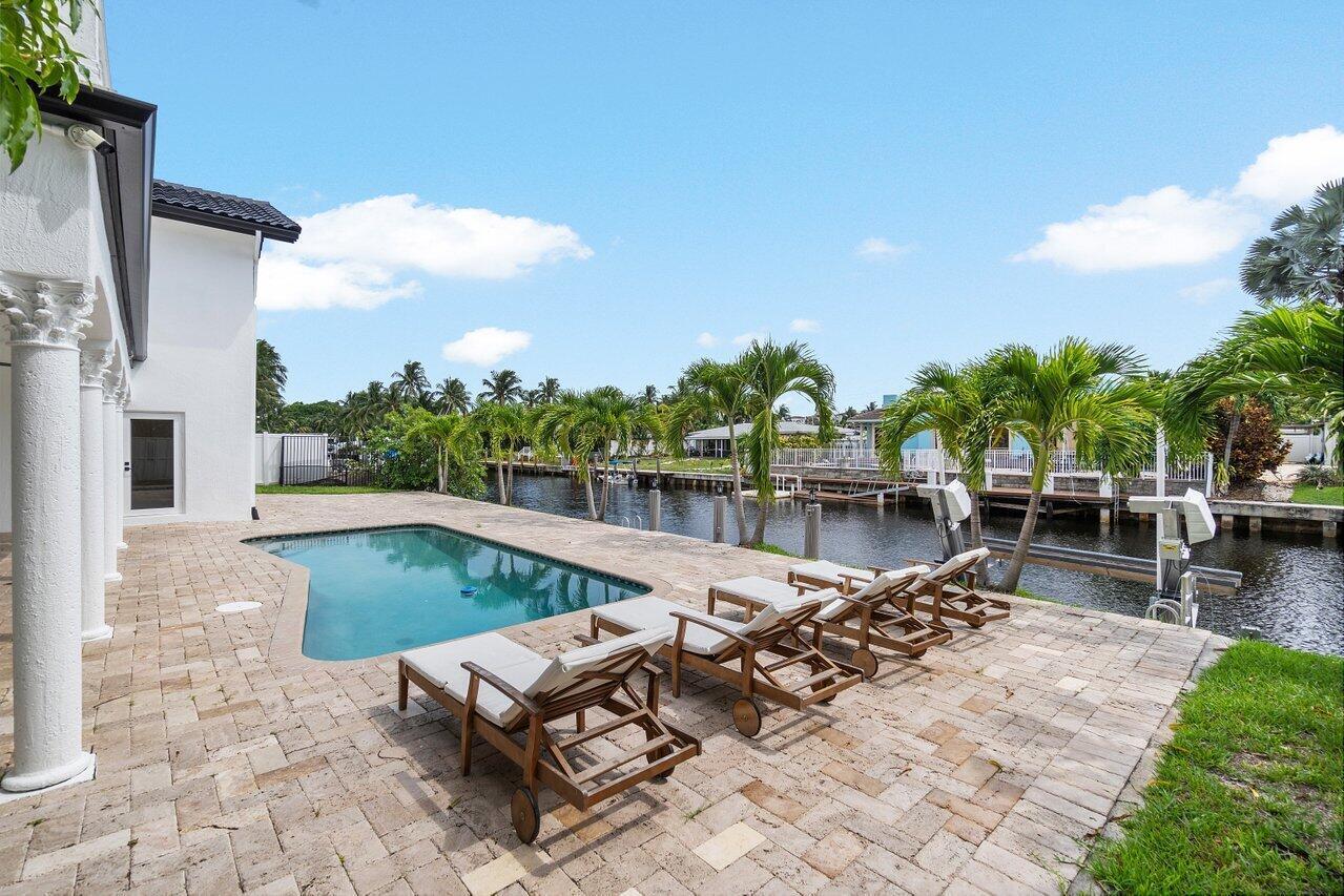 1366 Southwest 4th Court Boca Raton, FL 33432 - Photo 39 of 43 a view of swimming pool with outdoor seating and plants