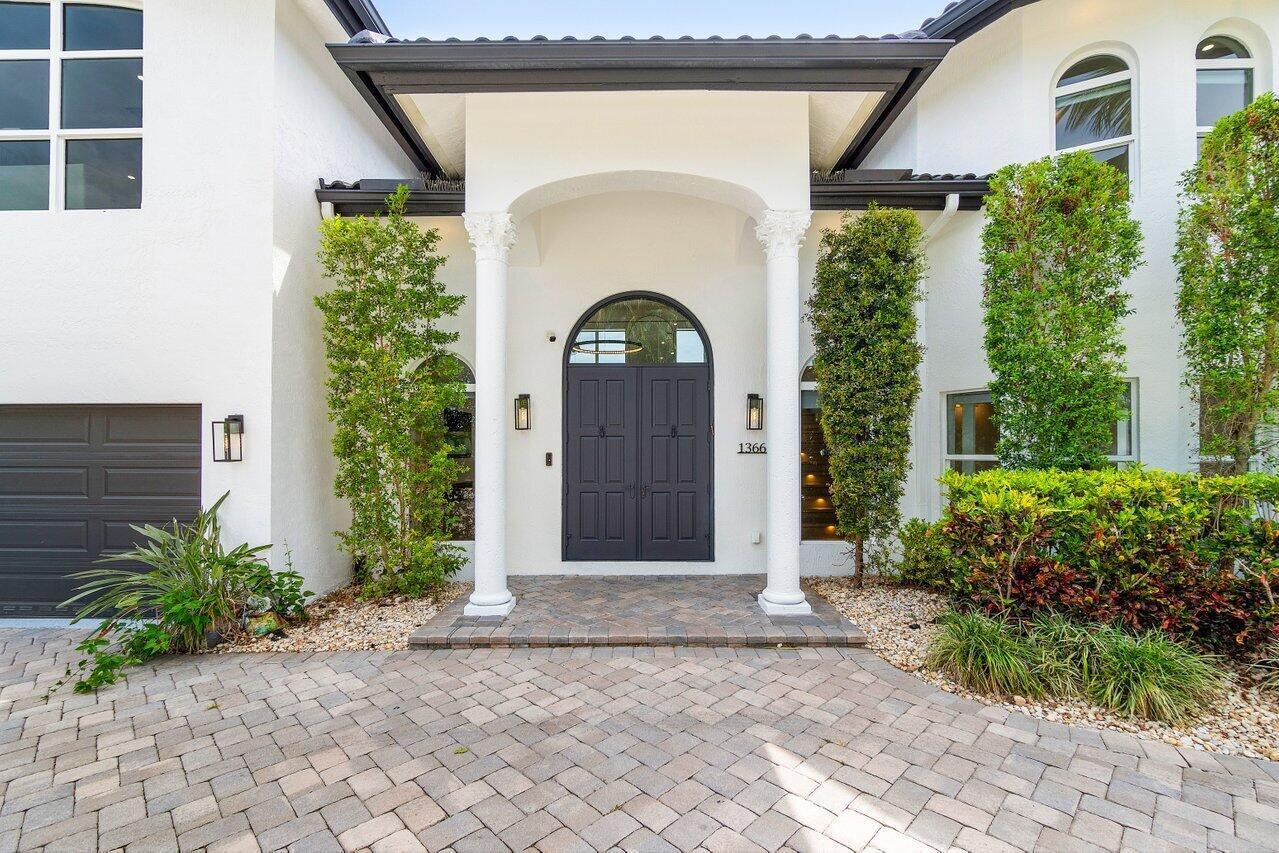 1366 Southwest 4th Court Boca Raton, FL 33432 - Photo 4 of 43 a front view of a house with garden