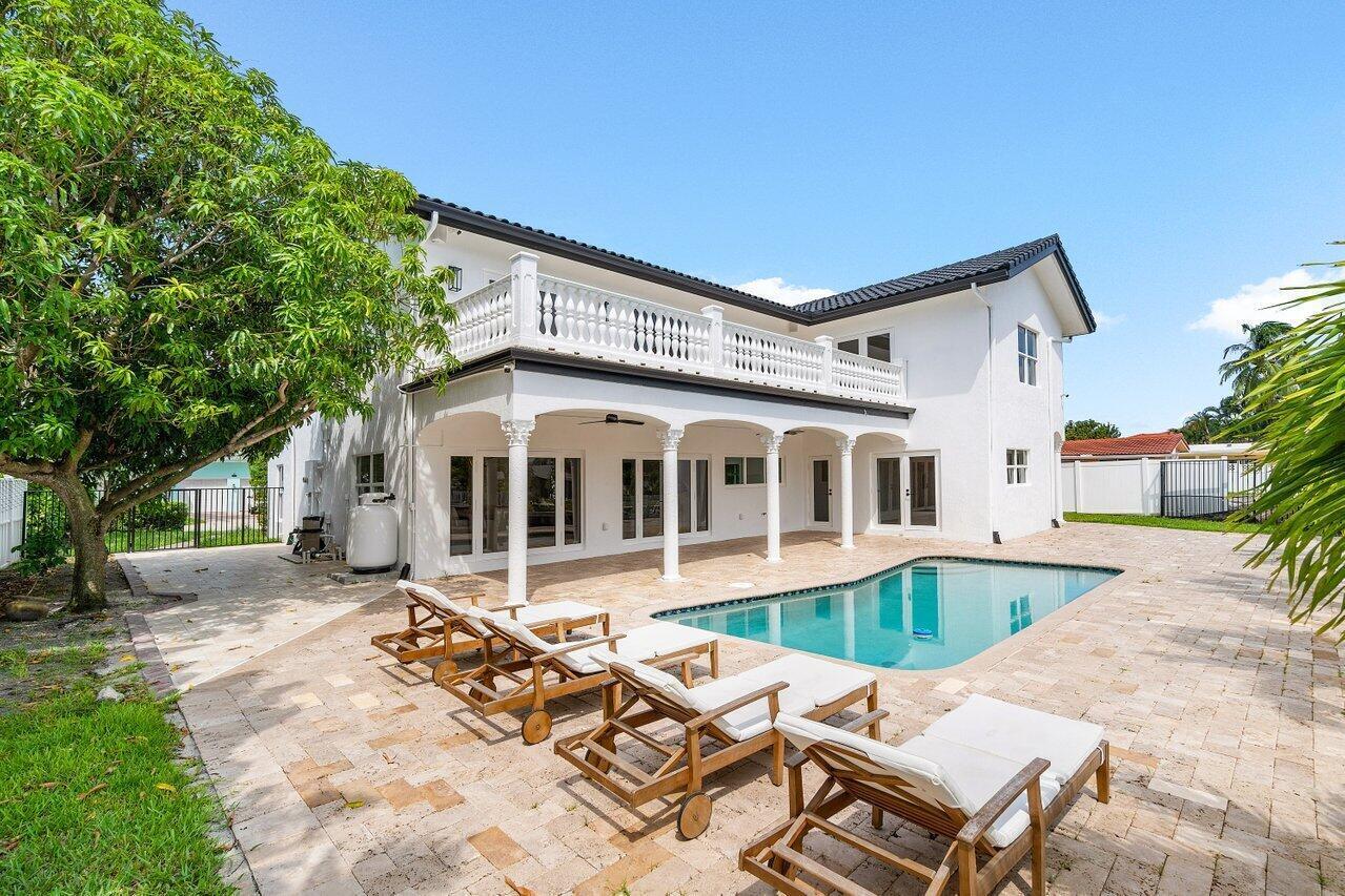 1366 Southwest 4th Court Boca Raton, FL 33432 - Photo 41 of 43 front view of a house with a patio