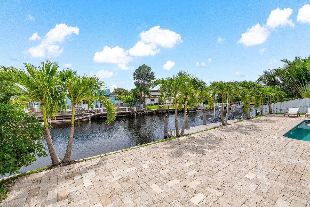 1366 Southwest 4th Court Boca Raton, FL 33432 - Photo 43 of 43 a view of a lake with palm trees