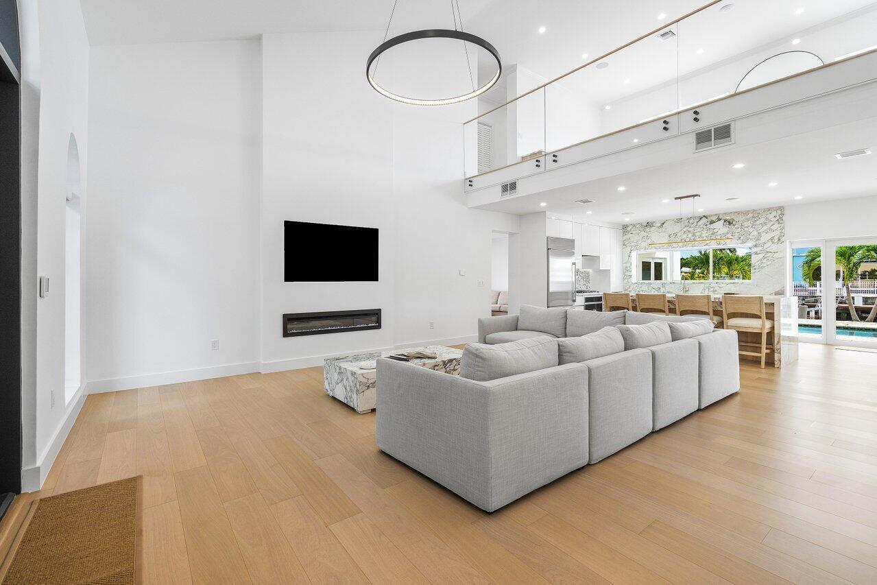 1366 Southwest 4th Court Boca Raton, FL 33432 - Photo 5 of 43 a living room with furniture and a flat screen tv