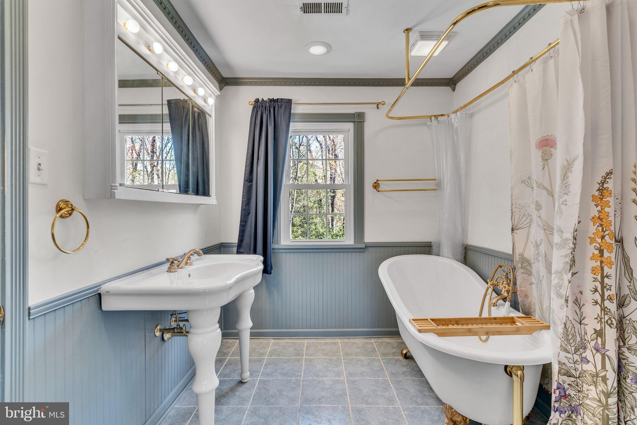 10231 3 Doctors Road Dunkirk, MD 20754 - Photo 27 of 63 a bathroom with a toilet sink and mirror