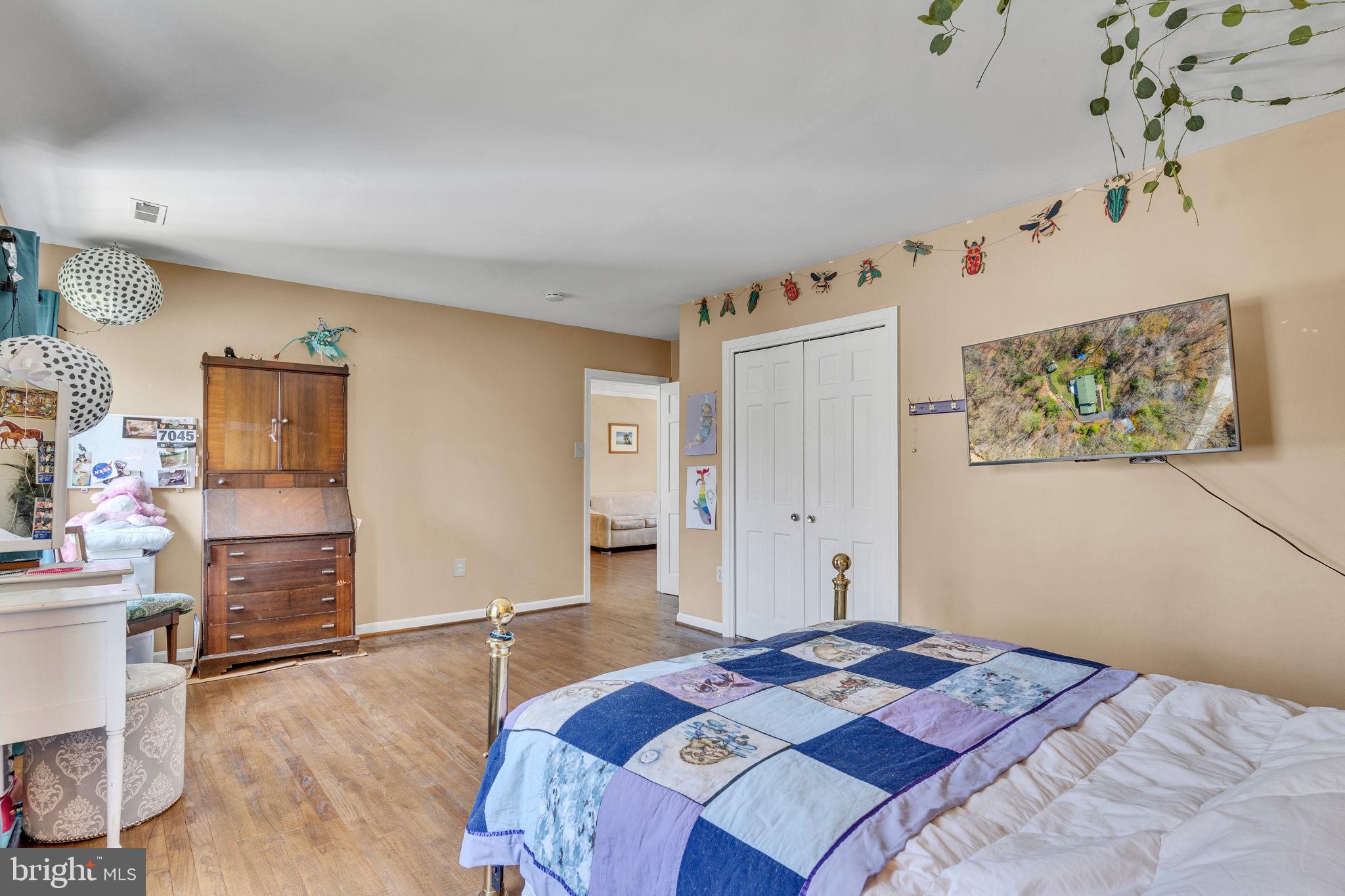 10231 3 Doctors Road Dunkirk, MD 20754 - Photo 30 of 63 a bedroom with a bed and a desk